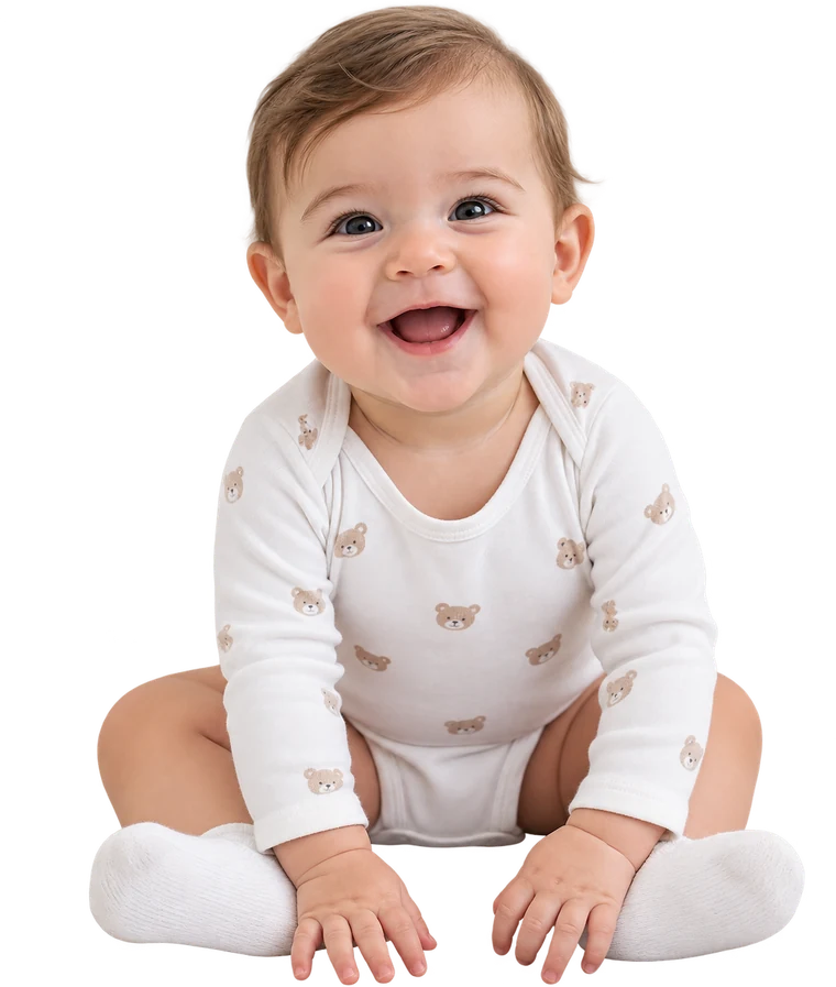 A baby sitting and smiling.